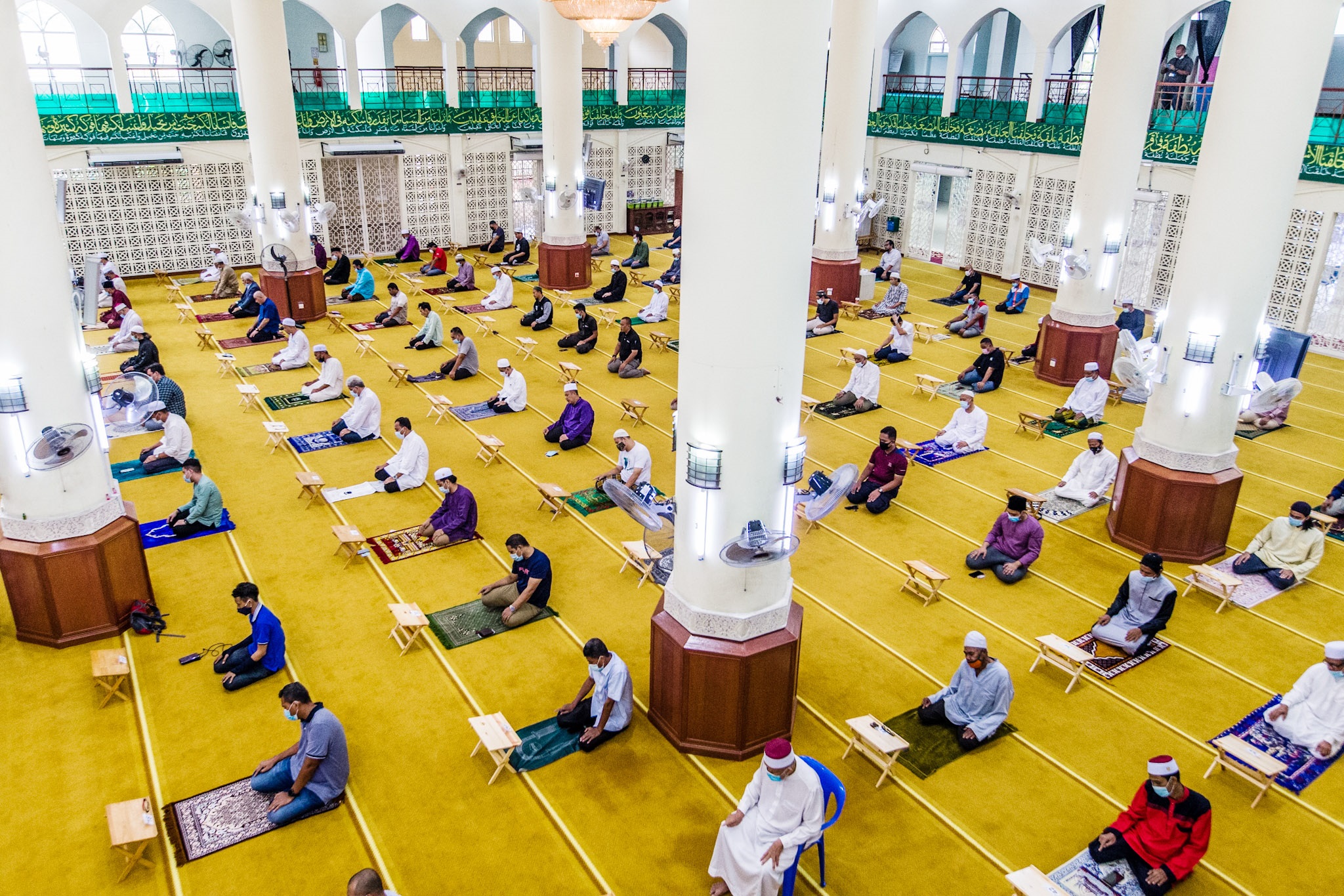 Muslims are spaced out at one-metre intervals to perform the compulsory Friday prayers at the Al-Hidayah Mosque in Kampung Sungai Penchala, Selangor. ― Picture by Firdaus Latif