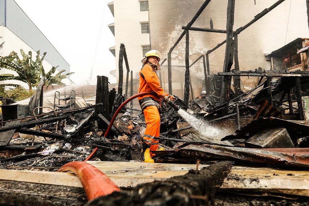 Fire and Rescue Department personnel and volunteer firefighters extinguishing the fire at Jalan Datuk Keramat in George Town December 1, 2020. u00e2u20acu201d Picture by Sayuti Zainudin