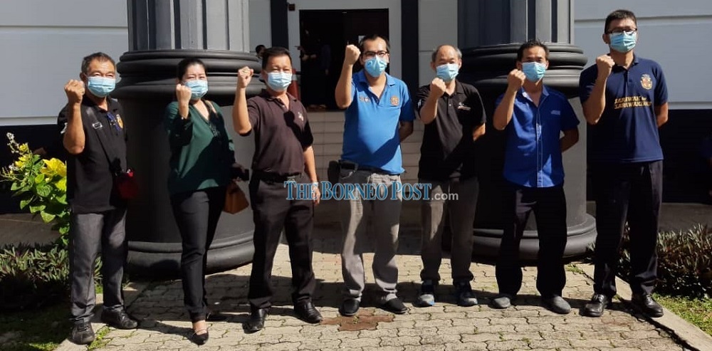 All seven accused in a jubilant mood after leaving the Kuching courthouse this morning. u00e2u20acu201d Borneo Post Online pic