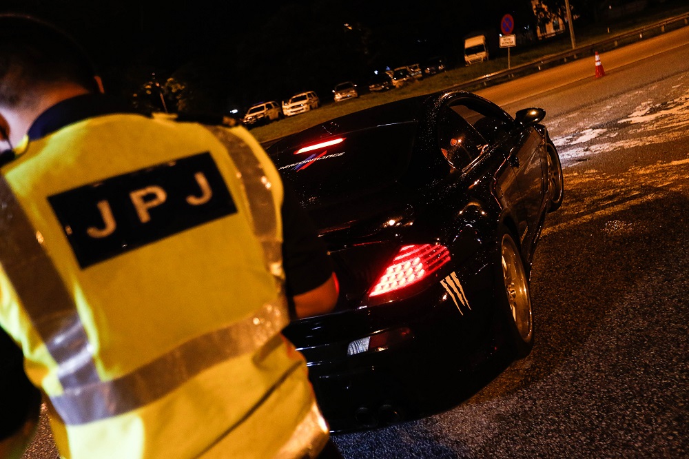 Road Transport Department personnel are seen at a roadblock at the Juru Toll Plaza in Simpang Ampat December 18, 2020. u00e2u20acu201d Picture by Sayuti Zainudin
