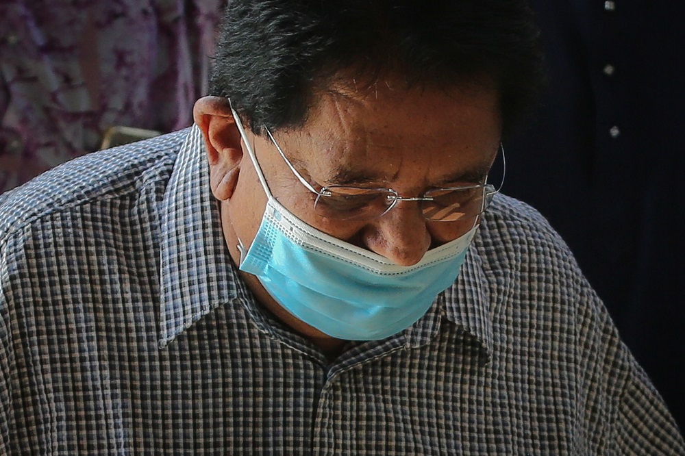 Former Federal Territories minister Datuk Seri Tengku Adnan Tengku Mansor arrives at the Kuala Lumpur Court Complex December 21, 2020. — Picture by Yusof Mat Isa