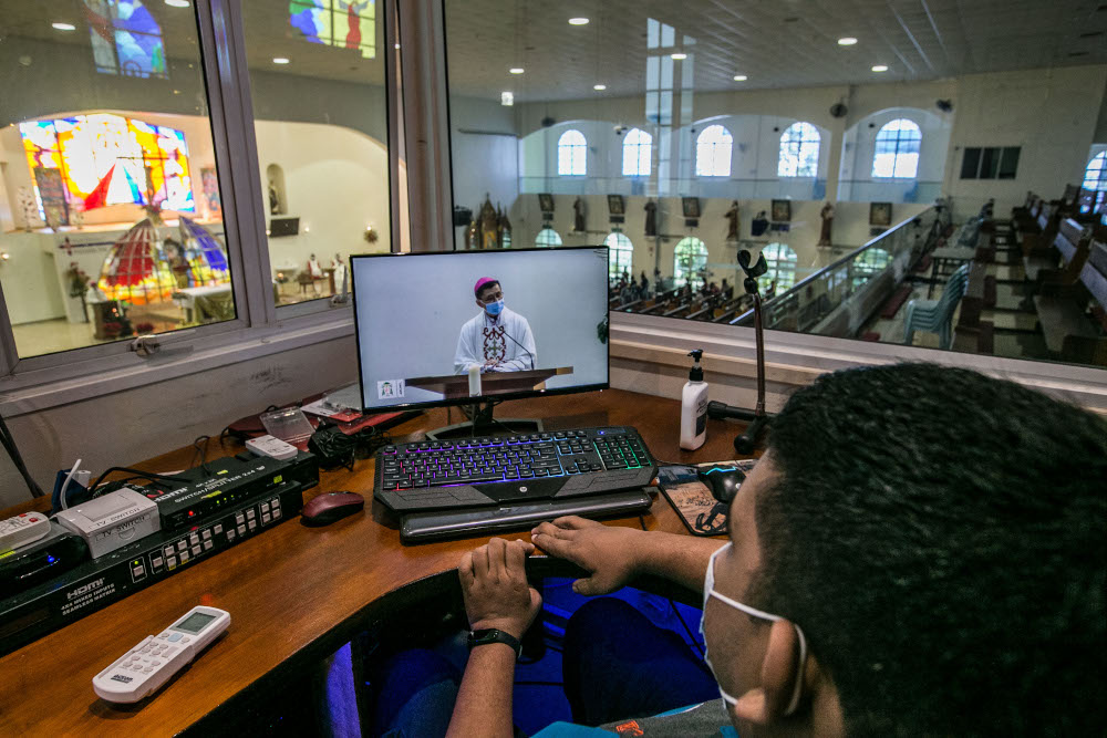 Archbishop of Kuala Lumpur Julian Leow Beng Kim conducting Christmas Mass at the Church of Divine Mercy which was livestreamed to the faithful in Shah Alam December 25, 2020. — Picture by Firdaus Latif