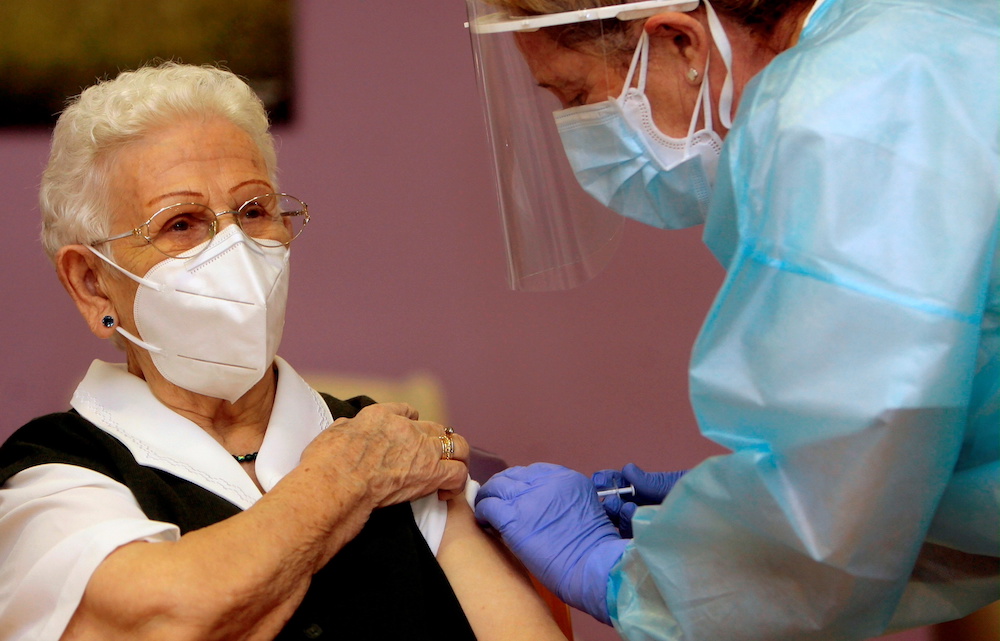 Los Olmos nursing home resident Araceli, 96, receives the first injection nationwide, with a dose of Pfizer-BioNTech Covid-19 vaccine, as the coronavirus disease (Covid-19) outbreak continues, in Guadalajara, Spain, December 27, 2020. u00e2u20acu201d Reuters pic 