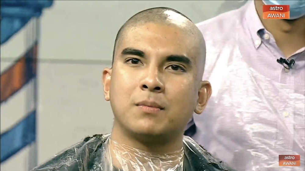 Syed Saddiq with his newly shaven head. — Screencap via AstroAwani/Twitter