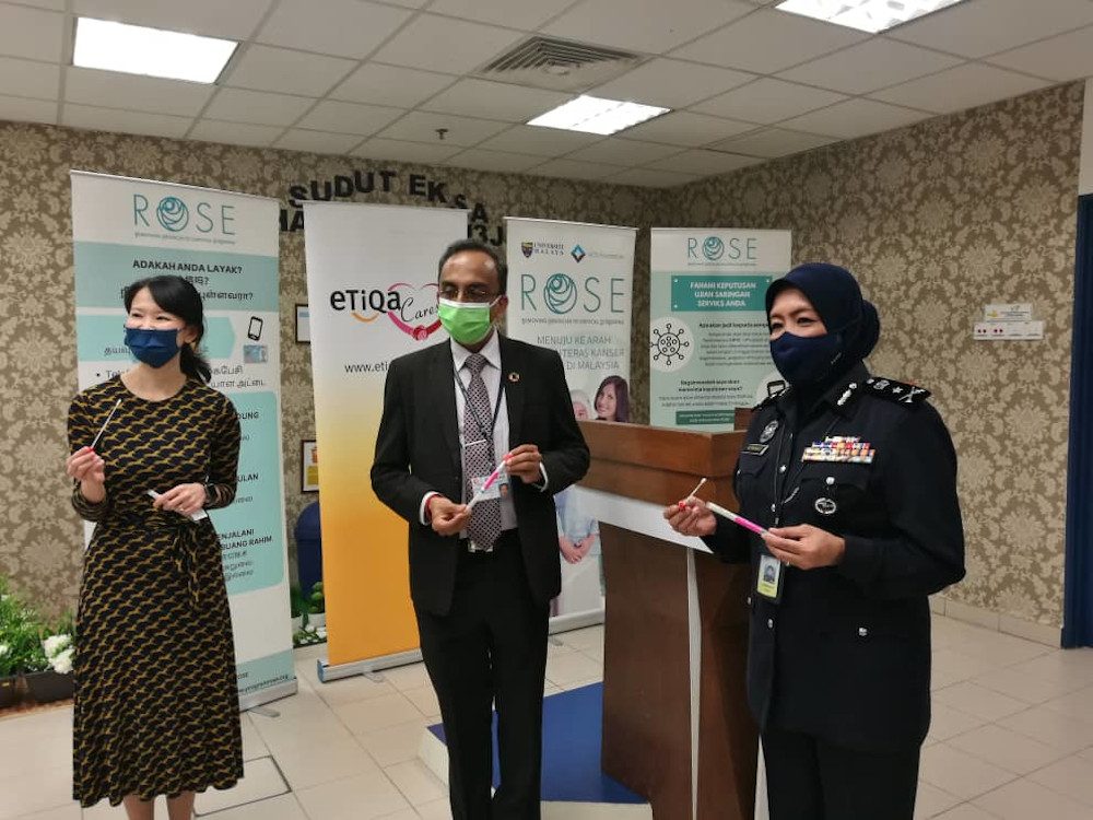 Bukit Aman Corporate Communications head Datuk Asmawati Ahmad (right) showing the HPV test kit at the Johor police contingent headquarters in Johor Baru December 21, 2020. u00e2u20acu201d Picture by Ben Tan