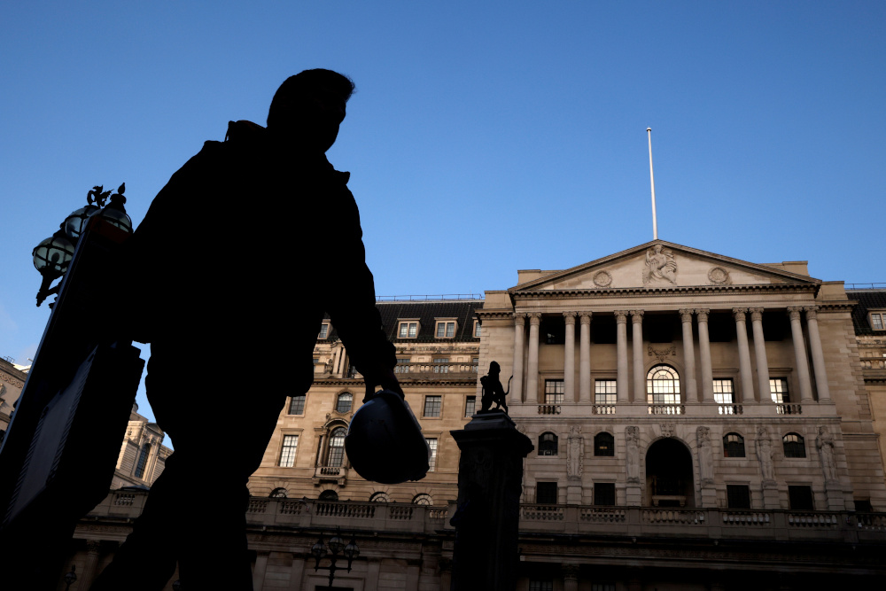 A person is silhouetted as he walks past the Bank of England, amid the outbreak of the coronavirus disease, in London, Britain, November 5, 2020. u00e2u20acu201d Reuters picnn