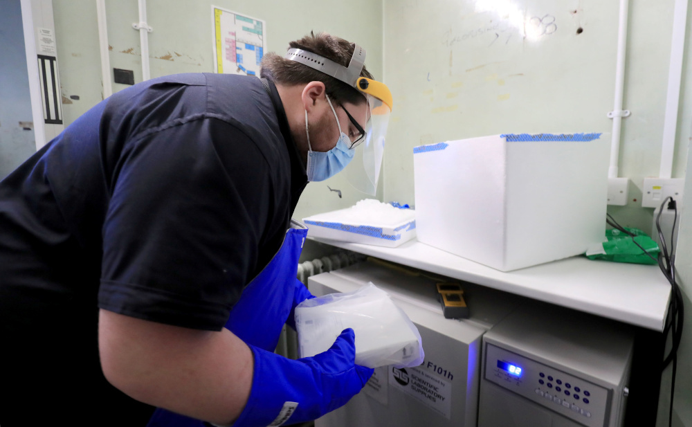 A pharmacy technician from Croydon Health Services prepares a delivery of the first batch of Covid-19 vaccinations at Croydon University Hospital in Croydon, Britain December 5, 2020. u00e2u20acu201d Reuters picnn
