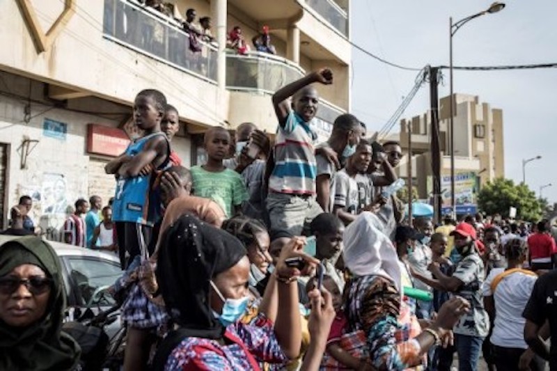 A group of young demonstrators chant slogans and gestures as they take part in a gathering in the streets of Dakar. u00e2u20acu2022 AFP-Relaxnews picnn