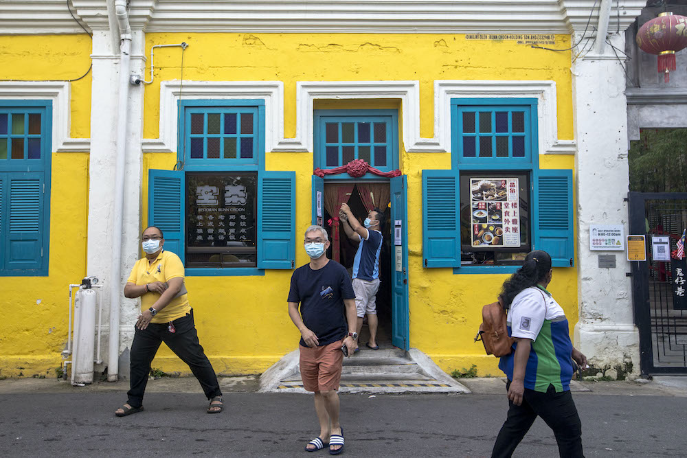 People wear protective masks in the streets of Kuala Lumpur December 12, 2020. u00e2u20acu201d Picture by Firdaus Latifnn