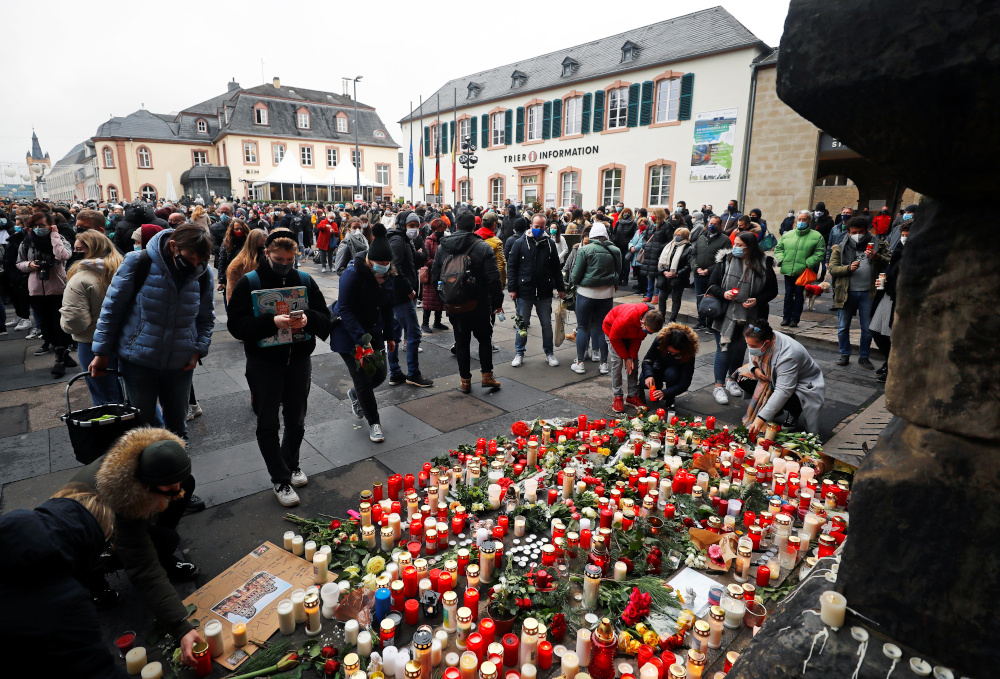 People pay their respects near the site where a car crashed into pedestrians in Trier, Germany, December 2, 2020. u00e2u20acu201d Reuters picnn