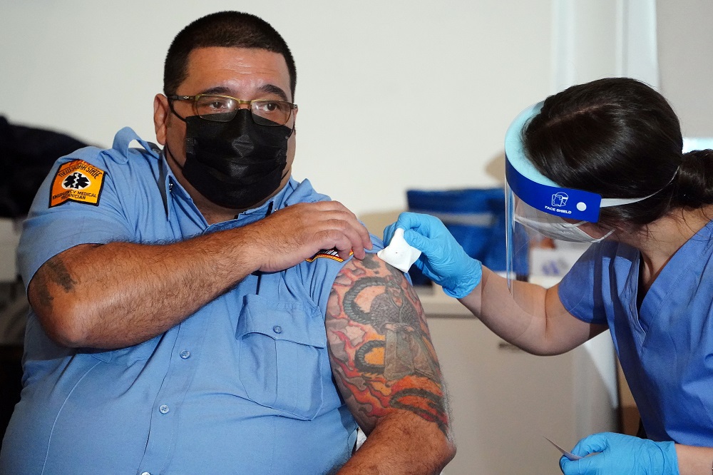 A worker of the New York City Fire Department Bureau of Emergency Medical Services (FDNY EMS) receives a Covid-19 Moderna vaccine in New York December 23, 2020. u00e2u20acu2022 Reuters pic