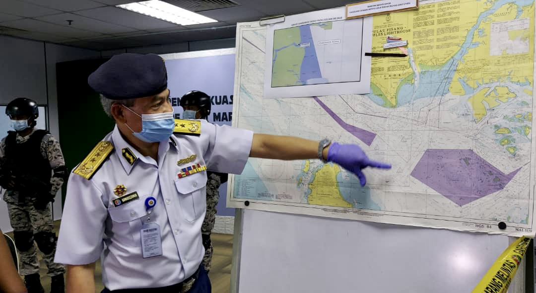 Rear Admiral Kamaruszaman Abu Hassan explaining the suspected drug smuggleru00e2u20acu2122s route at the Johor MMEA's headquarters in Johor Baru December 22, 2020. u00e2u20acu201d Picture by Ben Tan