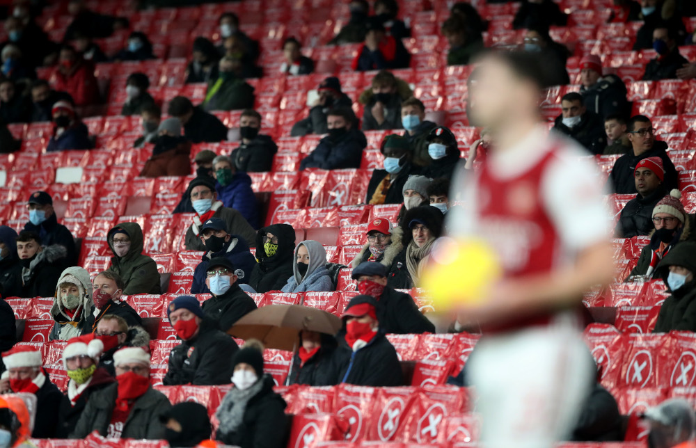 Arsenal fans watch Arsenalu00e2u20acu2122s Kieran Tierney at the Emirates Stadium, London, Britain, December 13, 2020. u00e2u20acu201d Reuters pic 