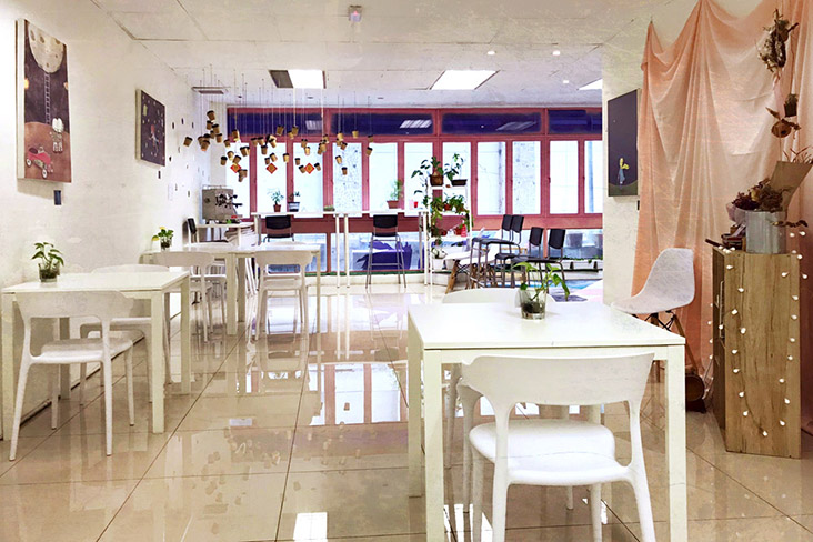 The simple yet inviting décor of KITA Coffee has the feeling of home.