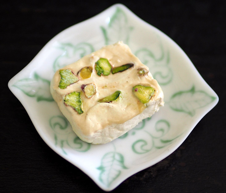 You get a small sweet treat of Persian nougat studded with pistachios sourced from the city of Boldaji.