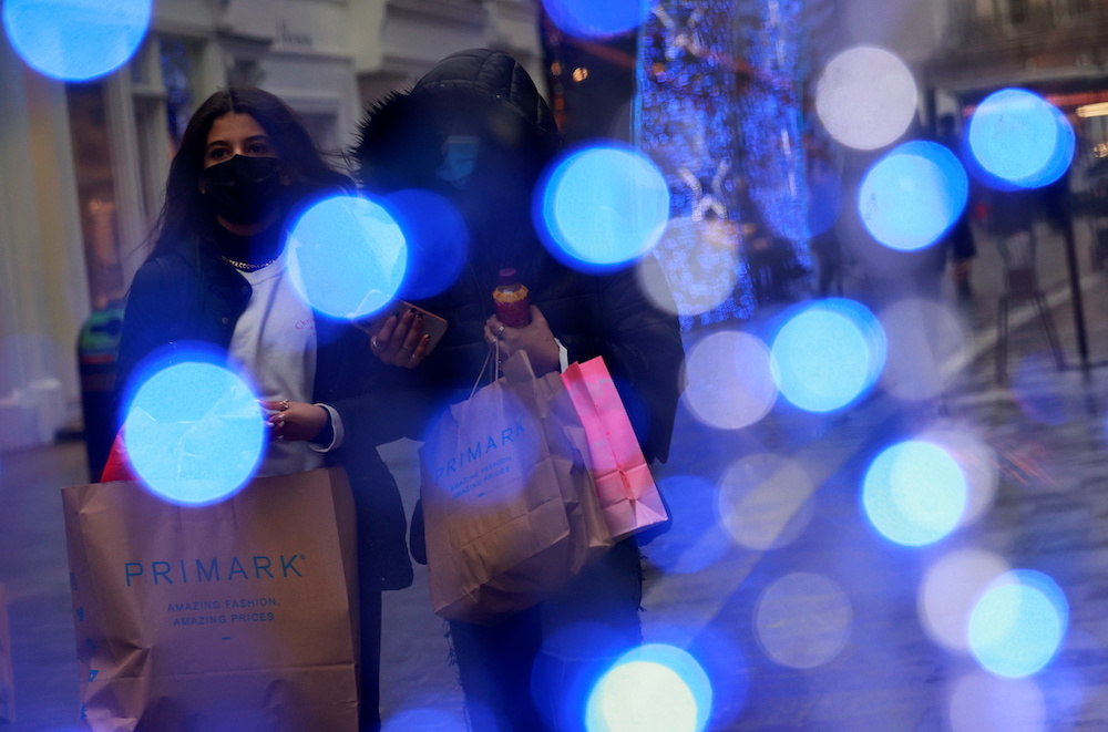 Shoppers walk down the street in London, Britain December 18, 2020. u00e2u20acu2022 Reuters picnn