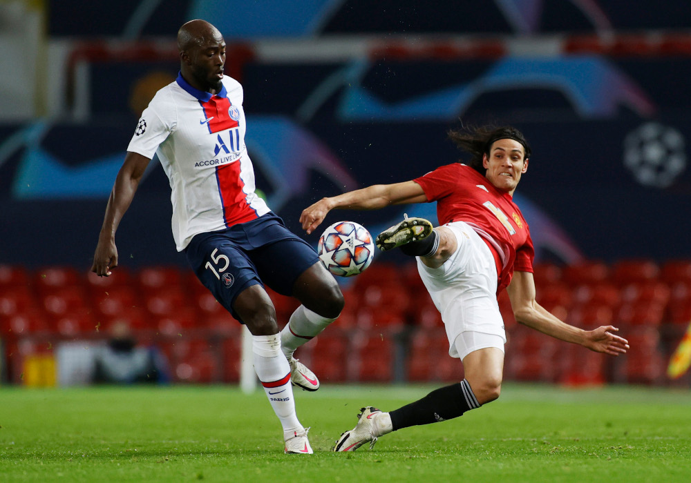 Paris St Germainu00e2u20acu2122s Danilo Pereira in action with Manchester Unitedu00e2u20acu2122s Edinson Cavani during the Champions League Group H match December 2, 2020 at Old Trafford. u00e2u20acu201d Reuters pic 