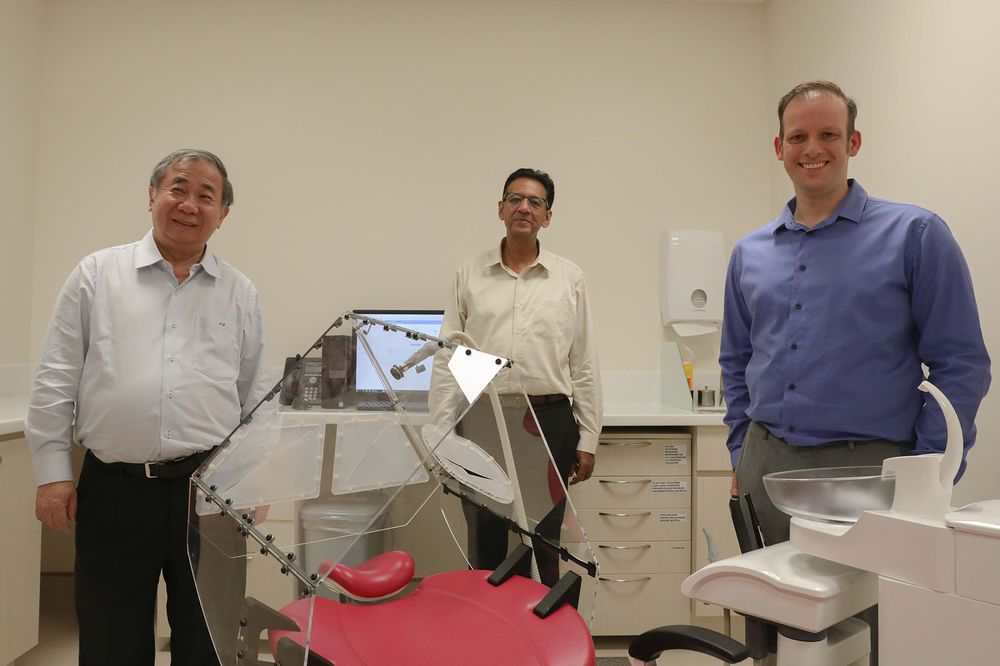 (From left) NUS deputy president (innovation and enterprise), Professor Freddy Boey, Sudarshan Anantharaman and Associate Professor Vinicius Rosa with the Dental Dart at the National University Centre For Oral Health Singapore, Dec 21. 2020. — TODAY pic