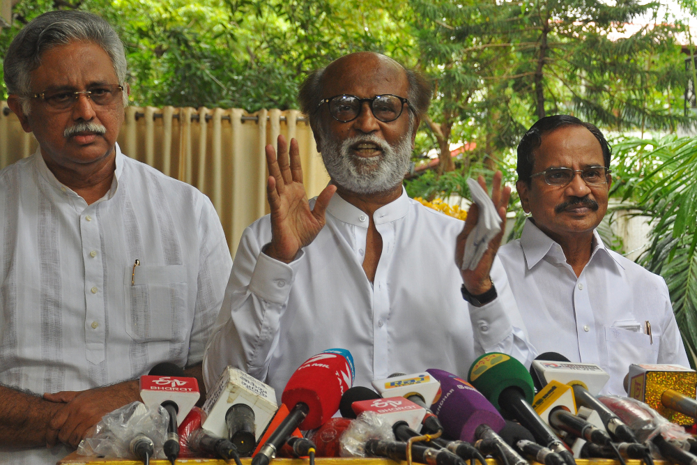 Indian actor Rajinikanth (centre) addresses the media representatives in front of his residence in Chennai December 3, 2020. u00e2u20acu201d AFP picnn