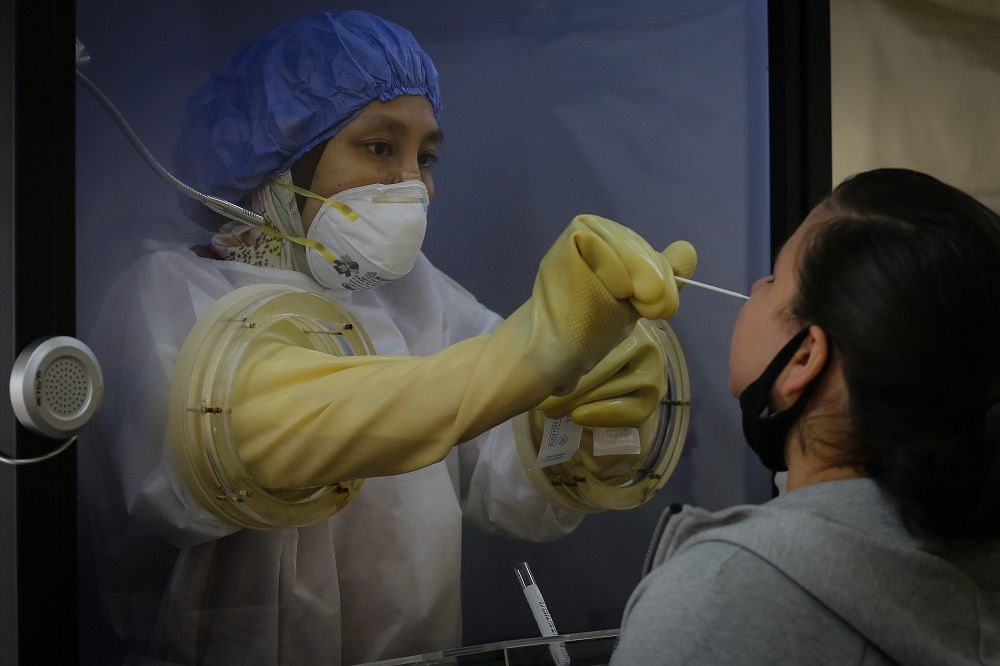 Dr Atfina said that frontliners collecting swab samples also spend hours on end under the scorching heat in full gear. — Picture by Yusof Mat Isa