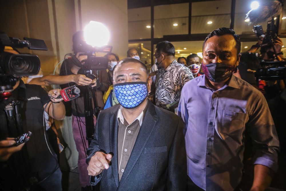 Perak Umno chief Datuk Saarani Mohamad (in blazer with blue patterned face mask), who is his party's choice for Perak mentri besar, leaves Menara Dato Onn in Kuala Lumpur after a meeting December 7, 2020. u00e2u20acu2022 Picture by Hari Anggara
