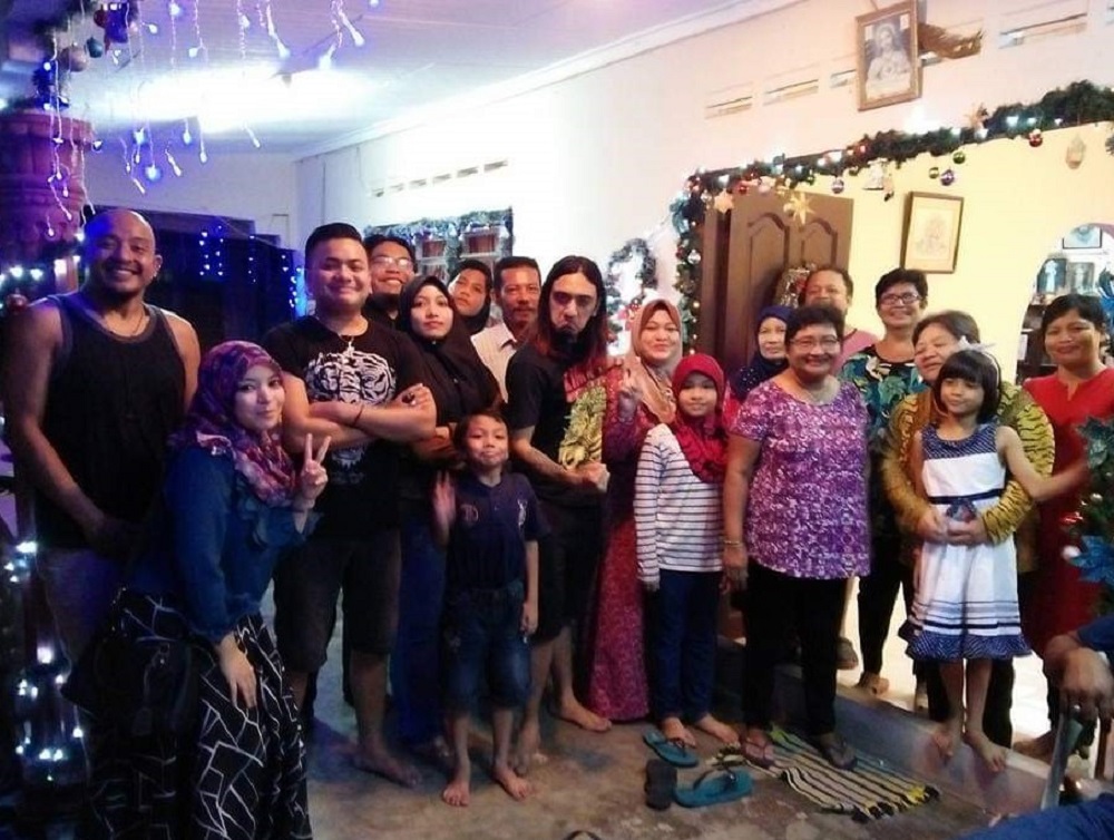 Singho and her family members on Christmas eve for one of the previous celebrations. ― Picture courtesy of Philomena Agnes Singho