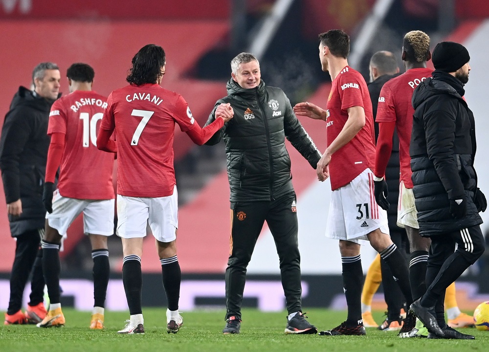 Manchester United manager Ole Gunnar Solskjaer celebrates with Nemanja Matic and Edinson Cavani after the match against Wolverhampton Wanderers December 30, 2020. u00e2u20acu2022 Pool via Reuters