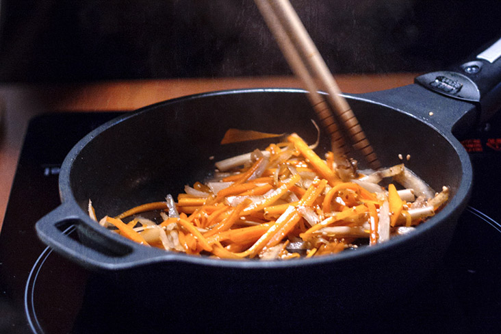 Sauté the root vegetables first so they soften before adding to the rice pot.