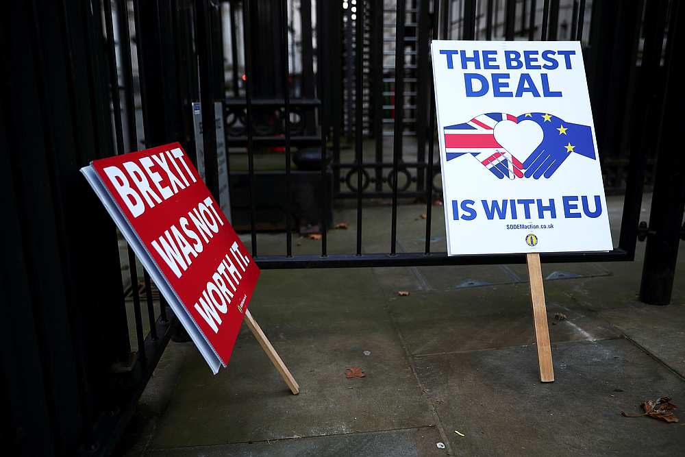 Anti-Brexit signs are pictured at the gates of Downing Street in London, Britain December 24, 2020. u00e2u20acu201d Reuters pic