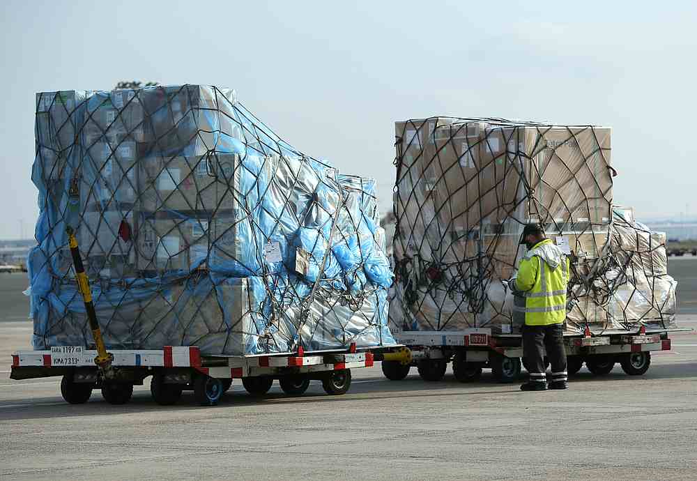 An employee checks freight at a ramp of Frankfurt airport, Germany, November 27, 2020. u00e2u20acu201d Reuters pic