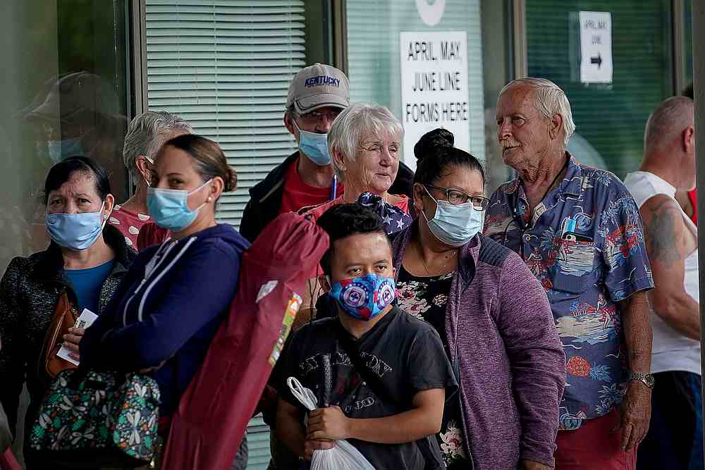 People line up outside a Kentucky Career Center hoping to find assistance with their unemployment claim in Frankfort, Kentucky June 18, 2020. u00e2u20acu201d Reuters pic