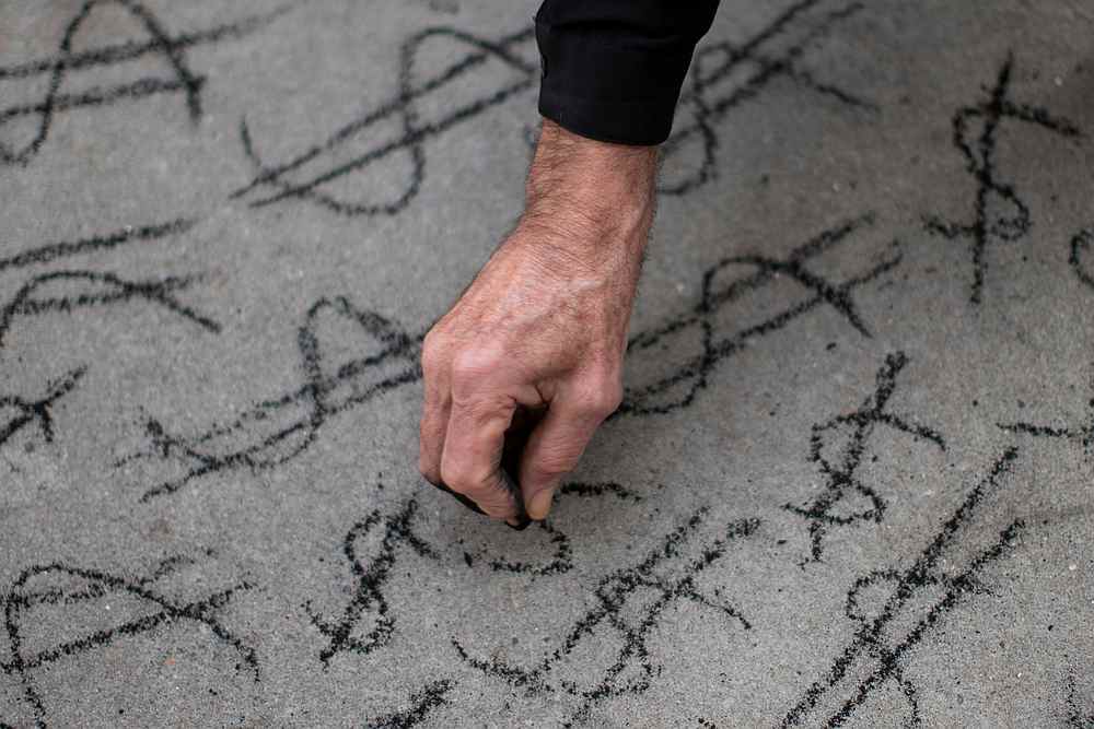 A man draws a money symbol as people take part in a protest called Make Amazon Pay, at the building where CEO Jeff Bezos lives in Manhattan, New York November 27, 2020. u00e2u20acu201d Reuters pic