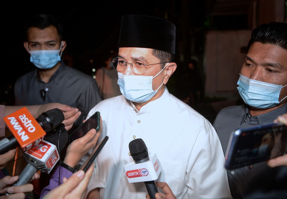 Datuk Seri Mohamed Azmin Ali speaks to reporters gathered outside the residence of the late Tun Rahah Mohamed Noah in Kuala Lumpur December 18, 2020. u00e2u20acu201d Bernama pic