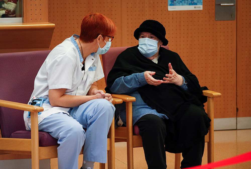 Balafia nursing home worker Sogues Sole, 51, and resident Milagros Garcia, 79, speak after receiving a dose of the Pfizer-BioNTech Covid-19 vaccine, in Lleida, Spain December 27, 2020. u00e2u20acu201d Reuters pic