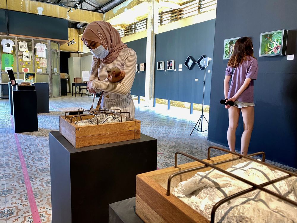 Visitor admiring the artwork at the u00e2u20acu02dcBoxed In (one foot at a time)u00e2u20acu2122 exhibition, held at the Hin Bus Depot exhibition space in Penang. u00e2u20acu201d Pix by Steven Ooi KE