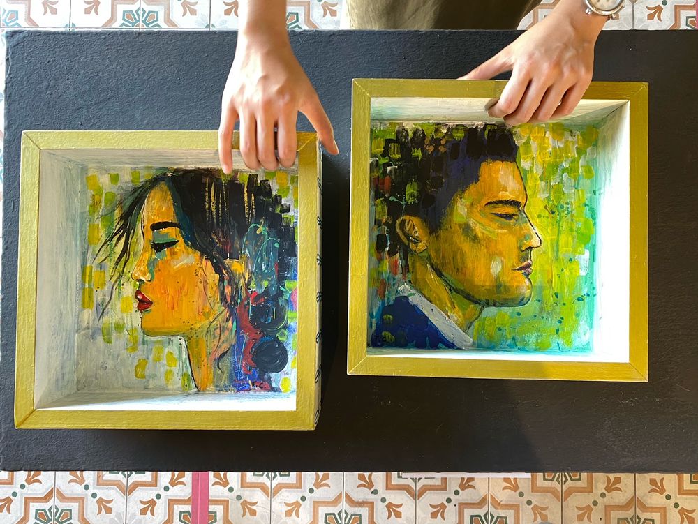 Interactive artwork by Tiffany Choong titled ‘Internal Monologues’ that allow visitors to arrange the position of the boxes that featured a male and a female head each.