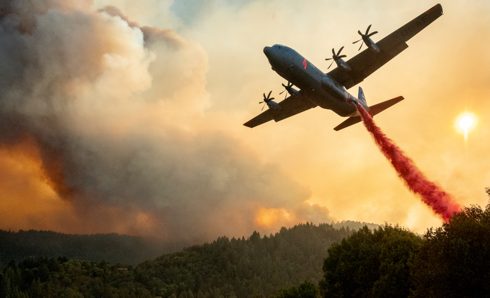 An aircraft drops fire retardant on a ridge during the Walbridge fire, part of the larger LNU Lightning Complex fire as flames continue to spread in Healdsburg, California August 20, 2020. u00e2u20acu201d AFP pic 