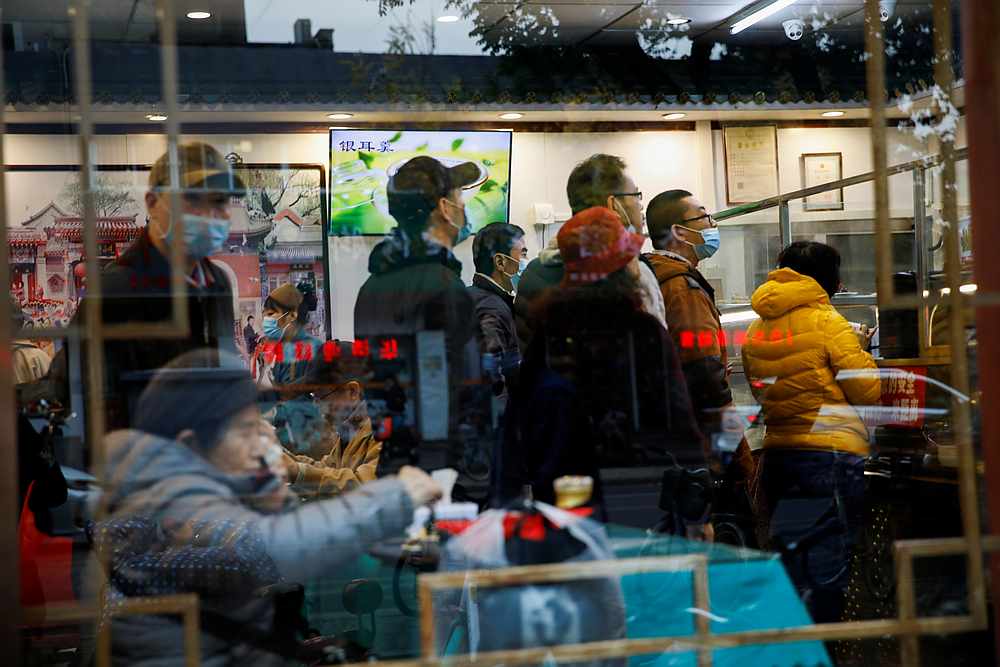 People queue at a restaurant during lunch time amid the Covid-19 outbreak in Beijing, China November 16, 2020. u00e2u20acu201d Reuters pic