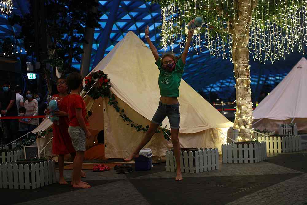 Children play with the Jurassic Mile Dino plush toys that come with the indoor glamping package at Changi Airport in Singapore December 21, 2020.  u00e2u20acu201d Reuters pic