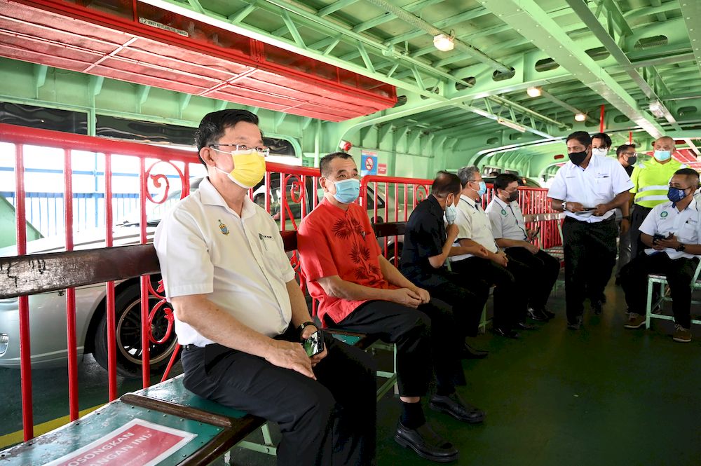 Penang Chief Minister Chow Kon Yeow is pictured riding the ferry as it docks at Pengkalan Raja Uda Ferry Terminal on December 30, 2020. — Picture courtesy of Penang Chief Minister’s Office