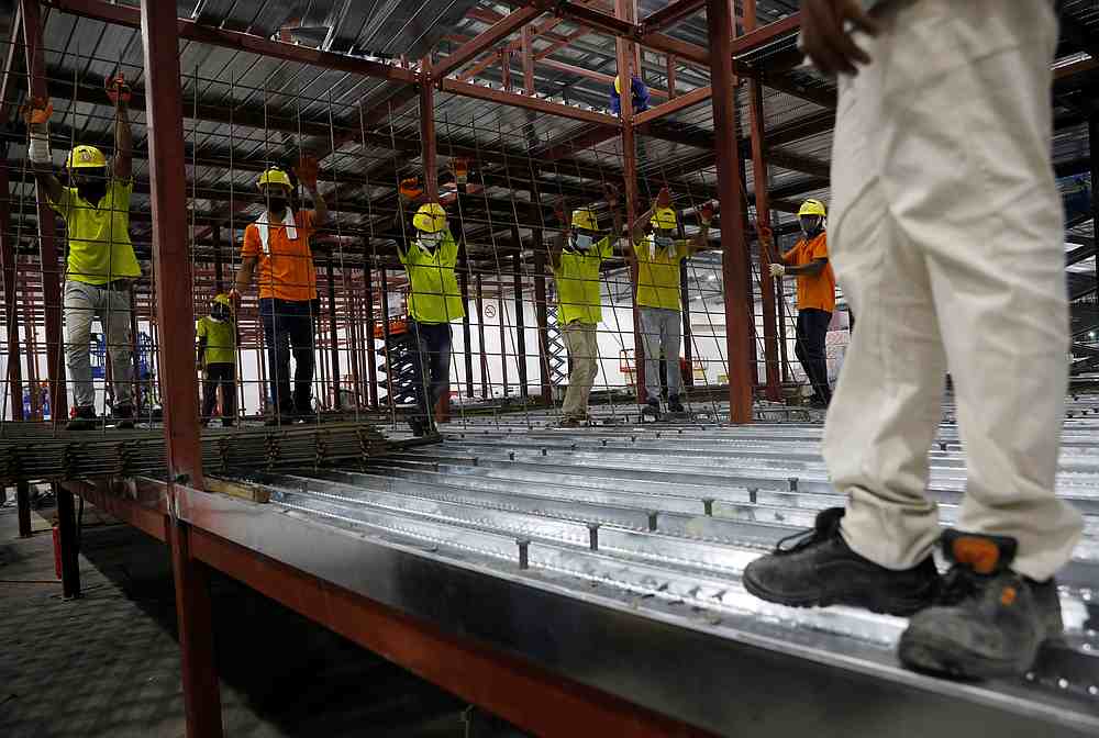 Workers construct guest rooms at Connect@Changi, a short-stay facility catered to business travellers as part of the upcoming segregated travel lane initiative during the Covid-19 outbreak, in Singapore December 21, 2020. u00e2u20acu201d Reuters pic