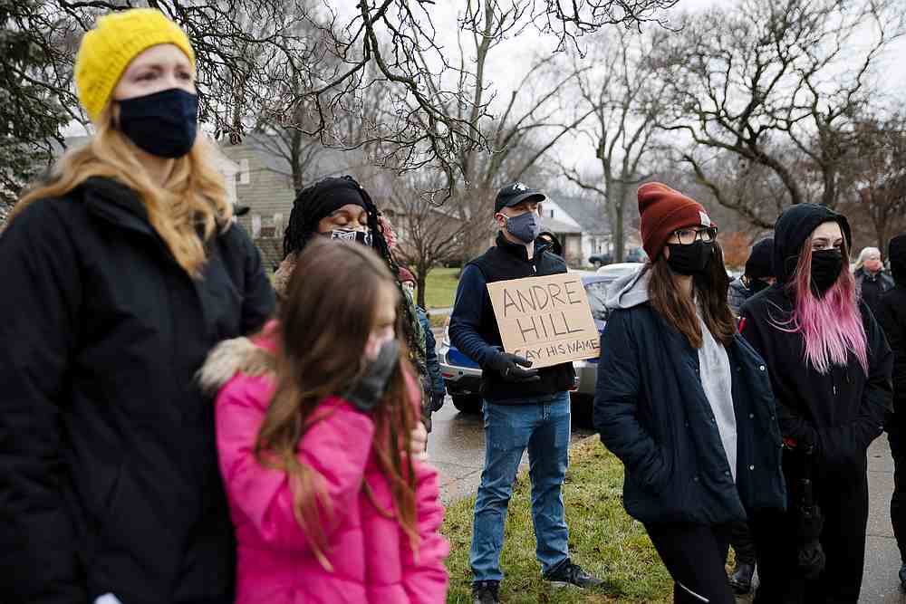 Protesters gather outside of the home where Andre Maurice Hill, 47, was killed in Columbus, Ohio December 24, 2020. u00e2u20acu201d Reuters pic