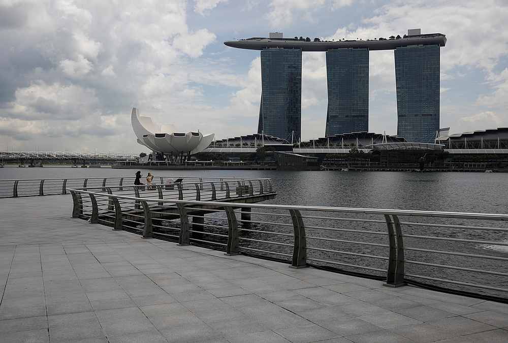 People take photos at an empty Merlion Park amid the Covid-19 pandemic, at the central business district in Singapore December 14, 2020.  u00e2u20acu201d Reuters pic