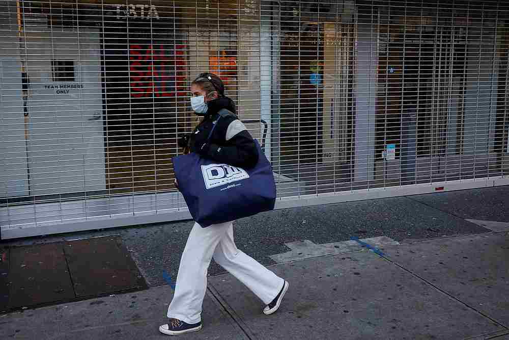 A shopper passes by a retail store that was recently closed in Brooklyn, New York December 8, 2020. u00e2u20acu201d Reuters pic