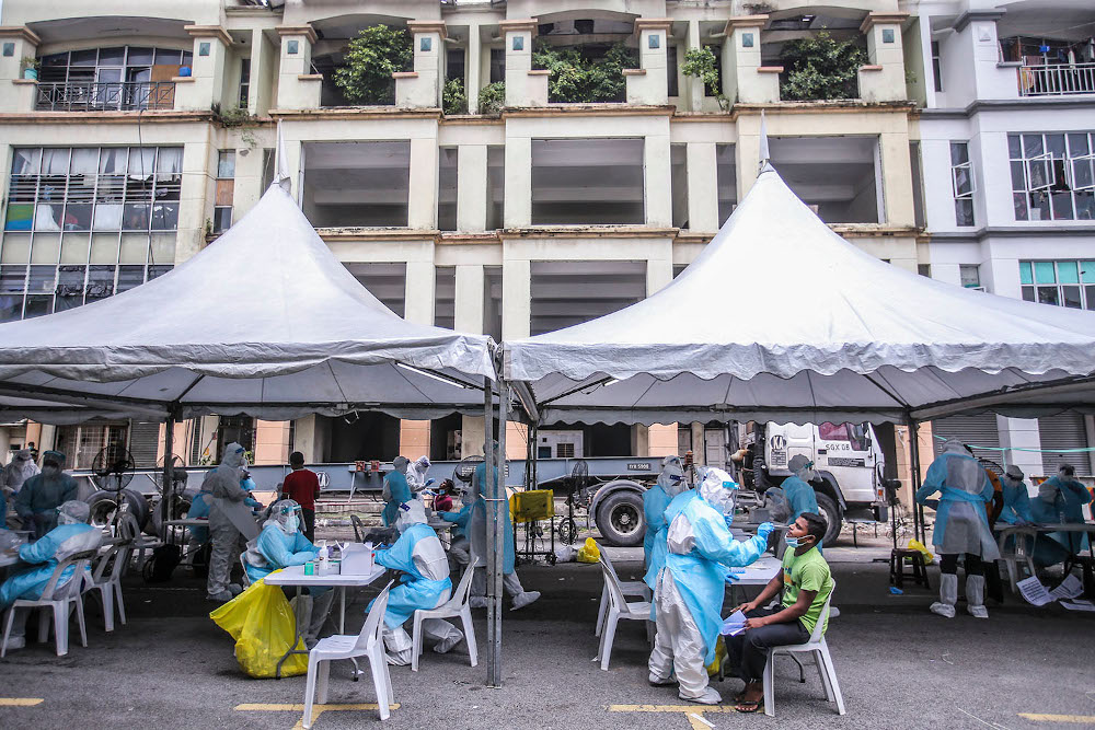 Health workers conduct a Covid-19 screening test on local and foreign workers at Central Spectrum, Pulau Indah, December 10, 2020. u00e2u20acu201d Picture by Hari Anggara