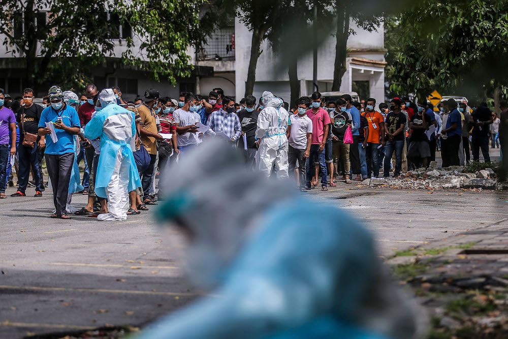 Health workers conduct a Covid-19 screening test on local and foreign workers at Central Spectrum, Pulau Indah, December 10, 2020. u00e2u20acu201d Picture by Hari Anggara