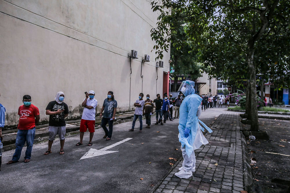 Health workers conduct a Covid-19 screening test on local and foreign workers at Central Spectrum, Pulau Indah, December 10, 2020. u00e2u20acu201d Picture by Hari Anggara