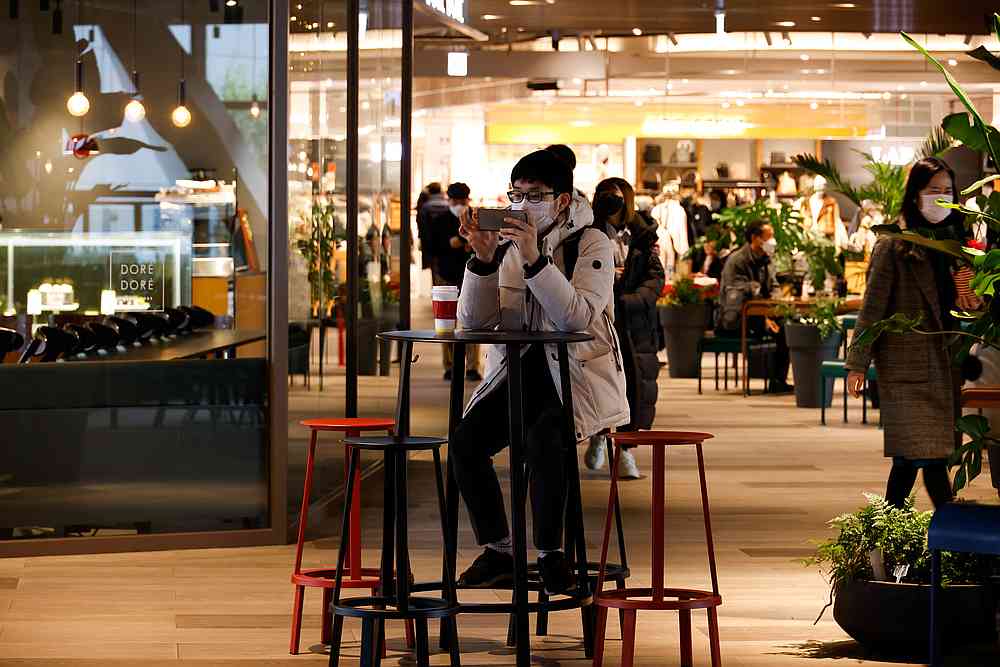 A man wearing a face mask uses his mobile phone at a shopping mall amid the Covid-19 outbreak in Seoul, South Korea December 2, 2020. u00e2u20acu201d Reuters pic