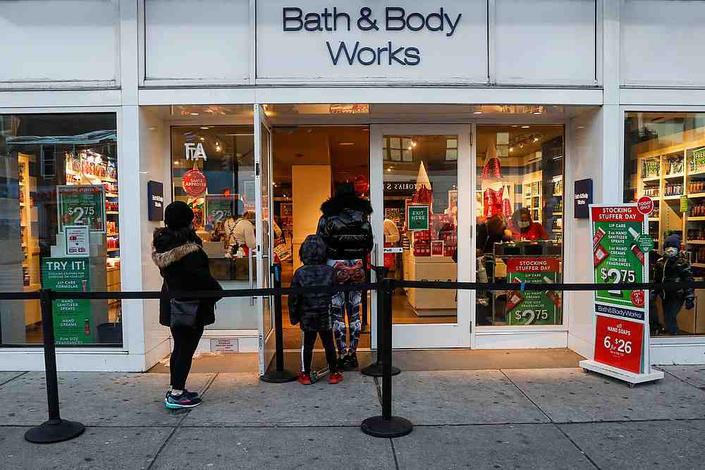Shoppers wait in line outside a Bath and Body Works retail store, as the global outbreak of Covid-19 continues, in Brooklyn, New York December 8, 2020. u00e2u20acu201d Reuters pic