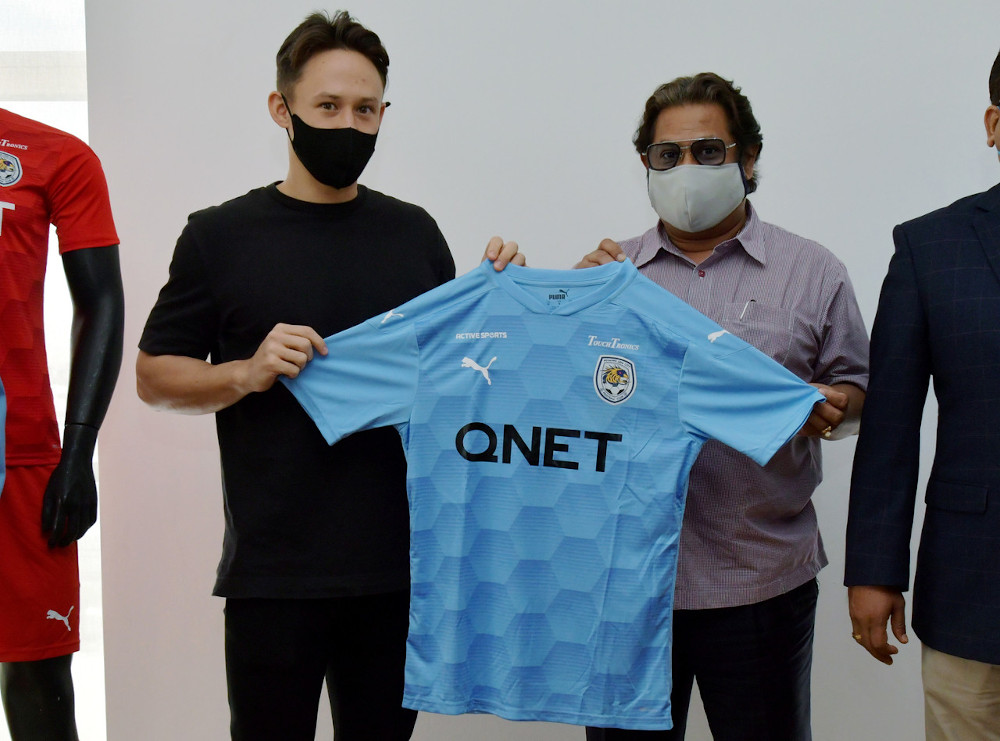 PJ City FC president Datuk Seri Subahan Kamal and Darren Lok with the PJ City FC jersey in Petaling Jaya December 14, 2020. u00e2u20acu201d Bernama pic